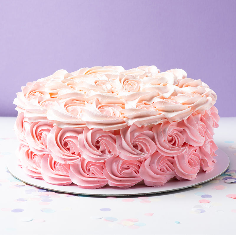 Ombré rosette cake hand piped in our bakery